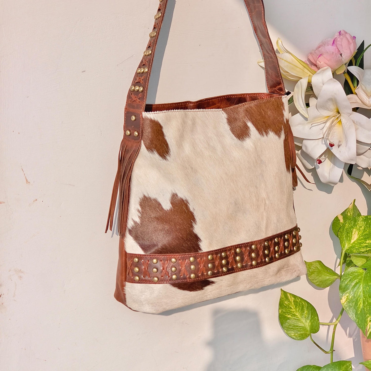 Cowhide Shoulder Bag – Western Leather Handbag with Studded Detail, Handmade Leather Strap & Tassels - JayKayBoutiqueOnline