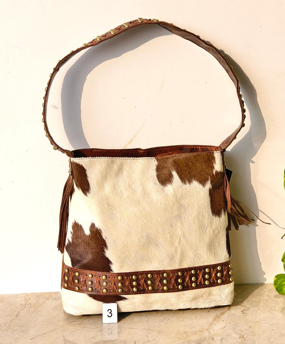 Cowhide Shoulder Bag – Western Leather Handbag with Studded Detail, Handmade Leather Strap & Tassels - JayKayBoutiqueOnline