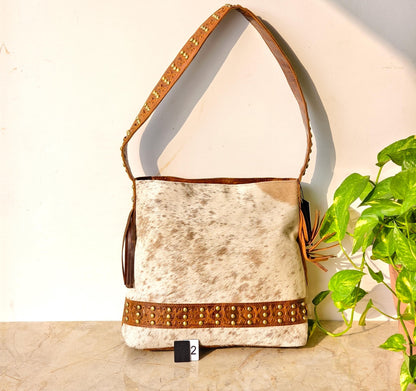 Cowhide Shoulder Bag – Western Leather Handbag with Studded Detail, Handmade Leather Strap & Tassels - JayKayBoutiqueOnline
