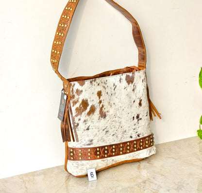 Cowhide Shoulder Bag – Western Leather Handbag with Studded Detail, Handmade Leather Strap & Tassels - JayKayBoutiqueOnline