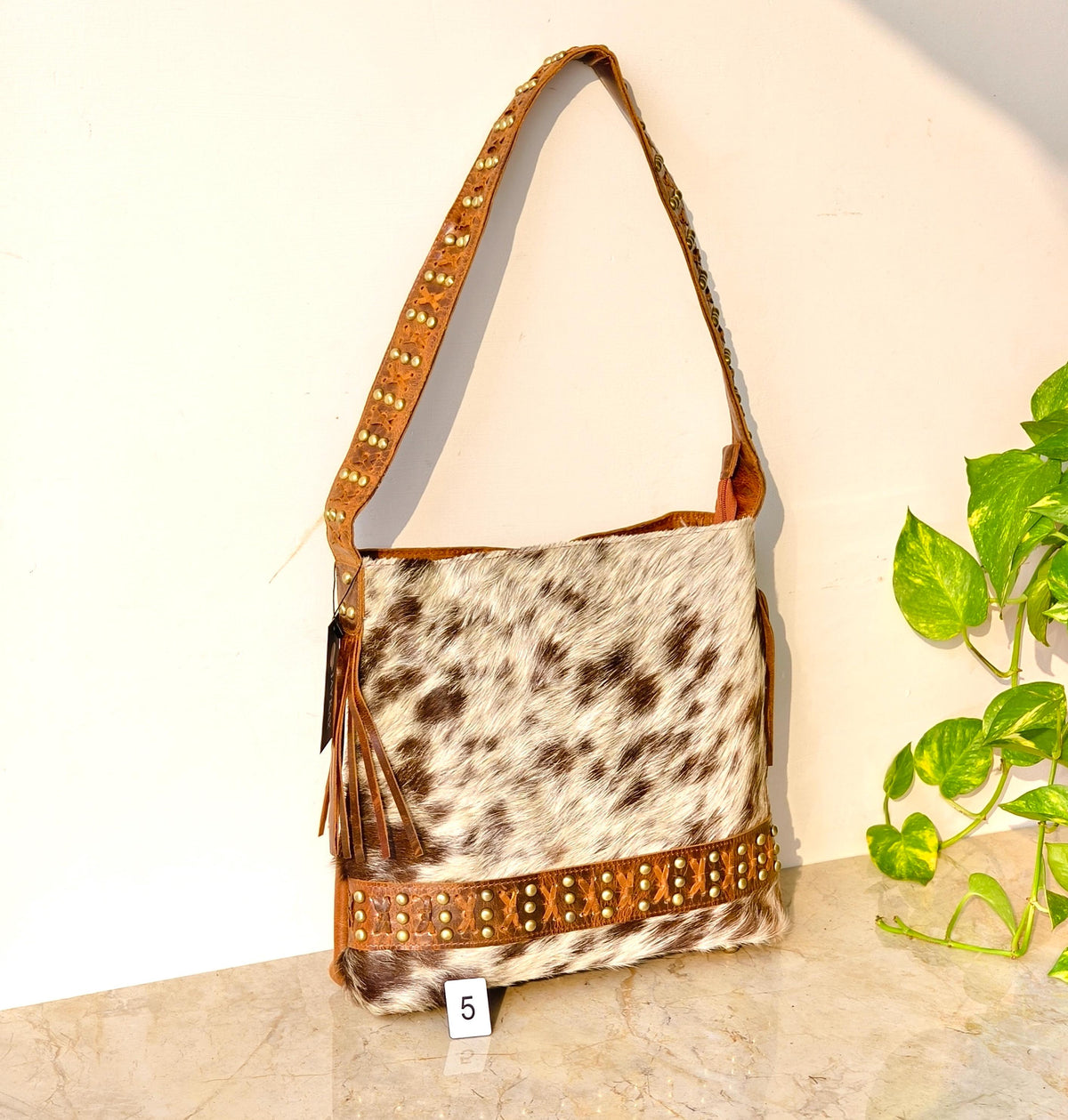 Cowhide Shoulder Bag – Western Leather Handbag with Studded Detail, Handmade Leather Strap & Tassels - JayKayBoutiqueOnline